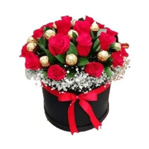 ARREGLO FLORAL ROSAS ROJAS EN CAJA CILINDRICA CON BOMBONES